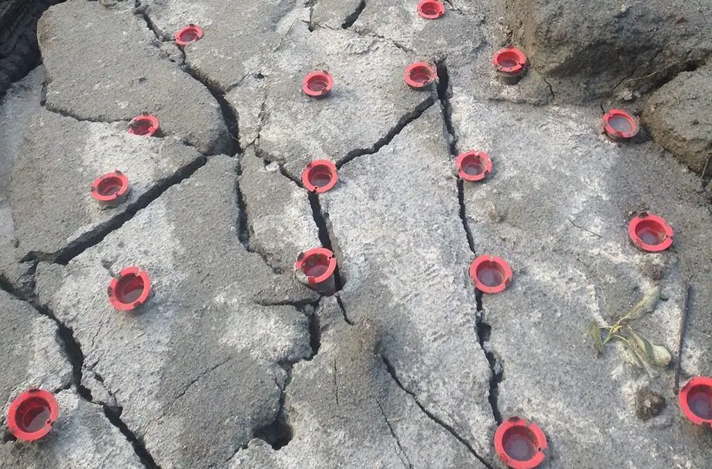 Expanding grout non-explosive rock breaking in progress