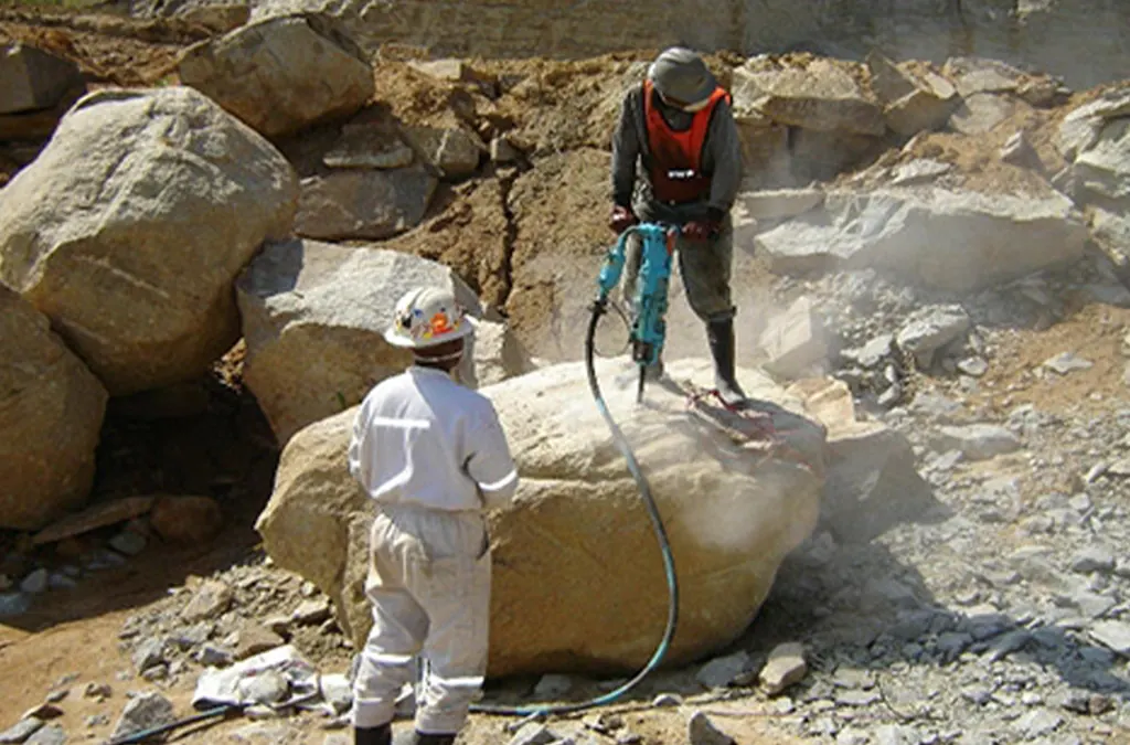 Rock fractured by expanding grout chemical demolition agent