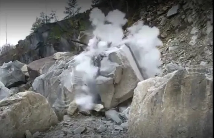 Hard rock broken to haulable size after a controlled blast
